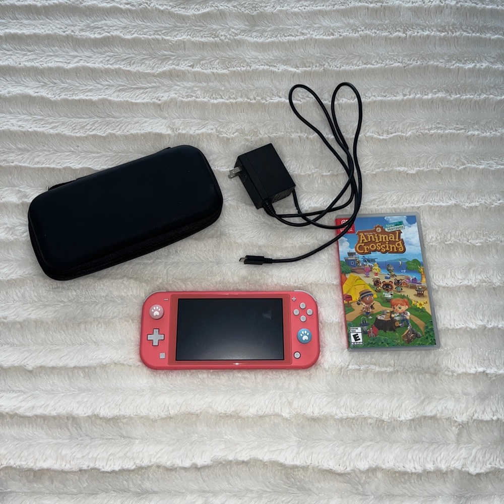 Nintendo Switch Lite in Coral + Animal Crossing GENTLY USED